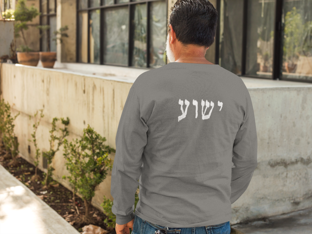 Man wearing a grey shirt with Yeshua on the back